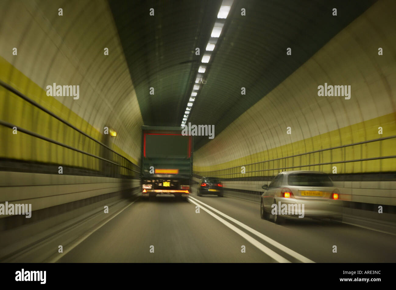 TRAFFIC TRAVELING AT SPEED ON A282 THROUGH DARTFORD TUNNEL CROSSING UNDER RIVER THAMES LONDON ENGLAND Stock Photo