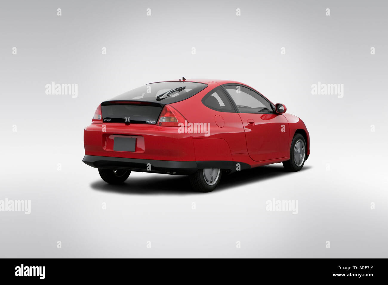 2006 Honda Insight Hybrid in Red - Rear angle view Stock Photo