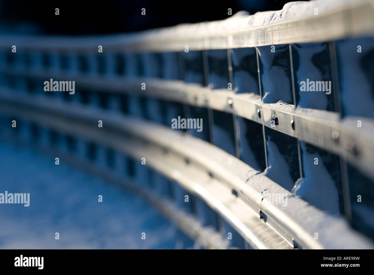 Closeup of a metallic snowy road bridge railing at Winter , Finland ...