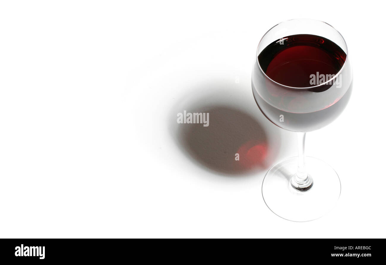 A glass of red wine on a white background. One of a series by the same photographer. Stock Photo