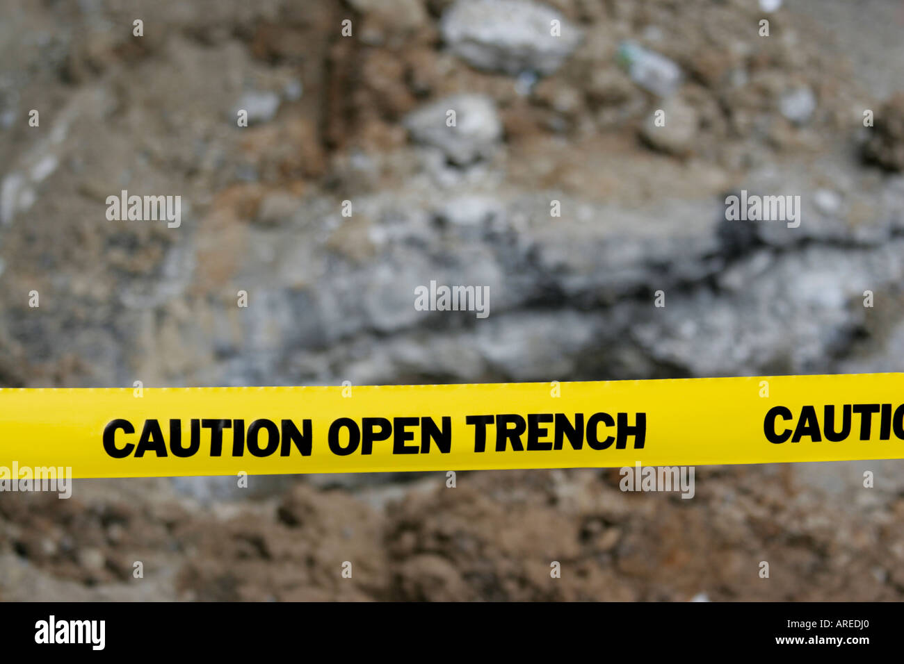 CAUTION OPEN TRENCH barrier tape with construction excavation in background Stock Photo Alamy