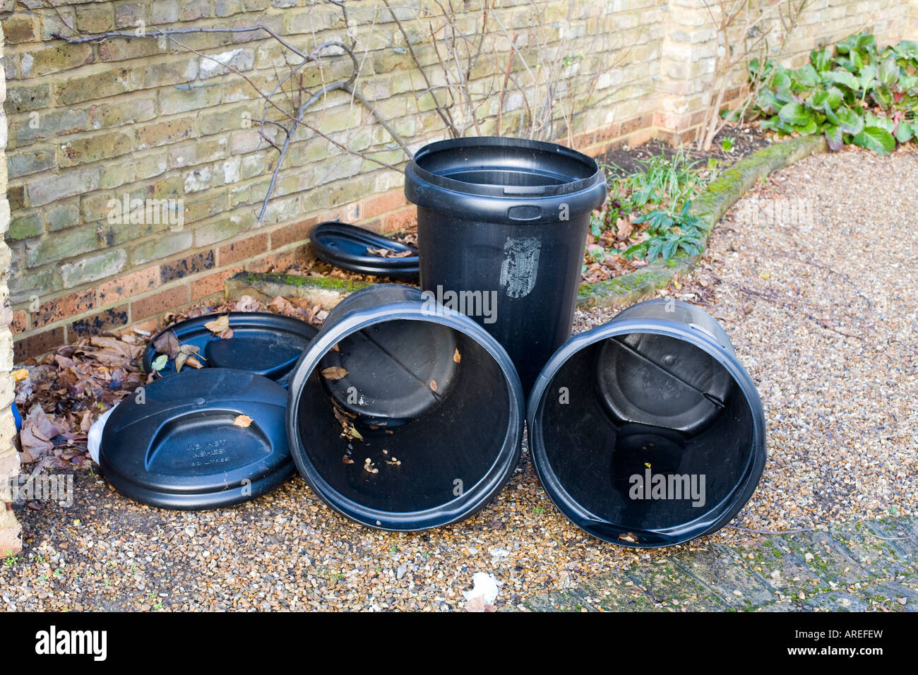 four empty dustbins in a street Stock Photo Alamy