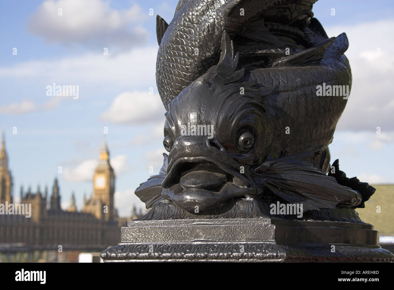 Lower Section of an Ornate Lampost with a Fish Design on the South Bank of the River Thames Opposite Westminster Palace Stock Photo