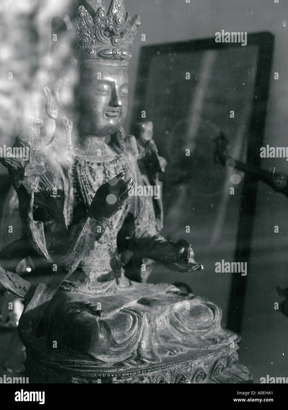 Hindu statue in an antique store window Stock Photo Alamy