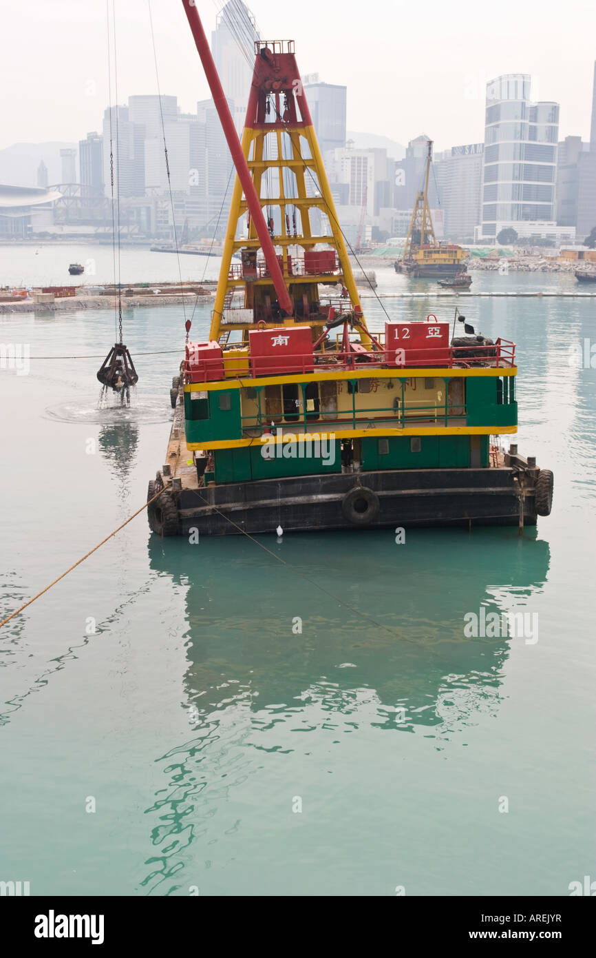 Land reclamation barge in Hong Kong harbour Stock Photo