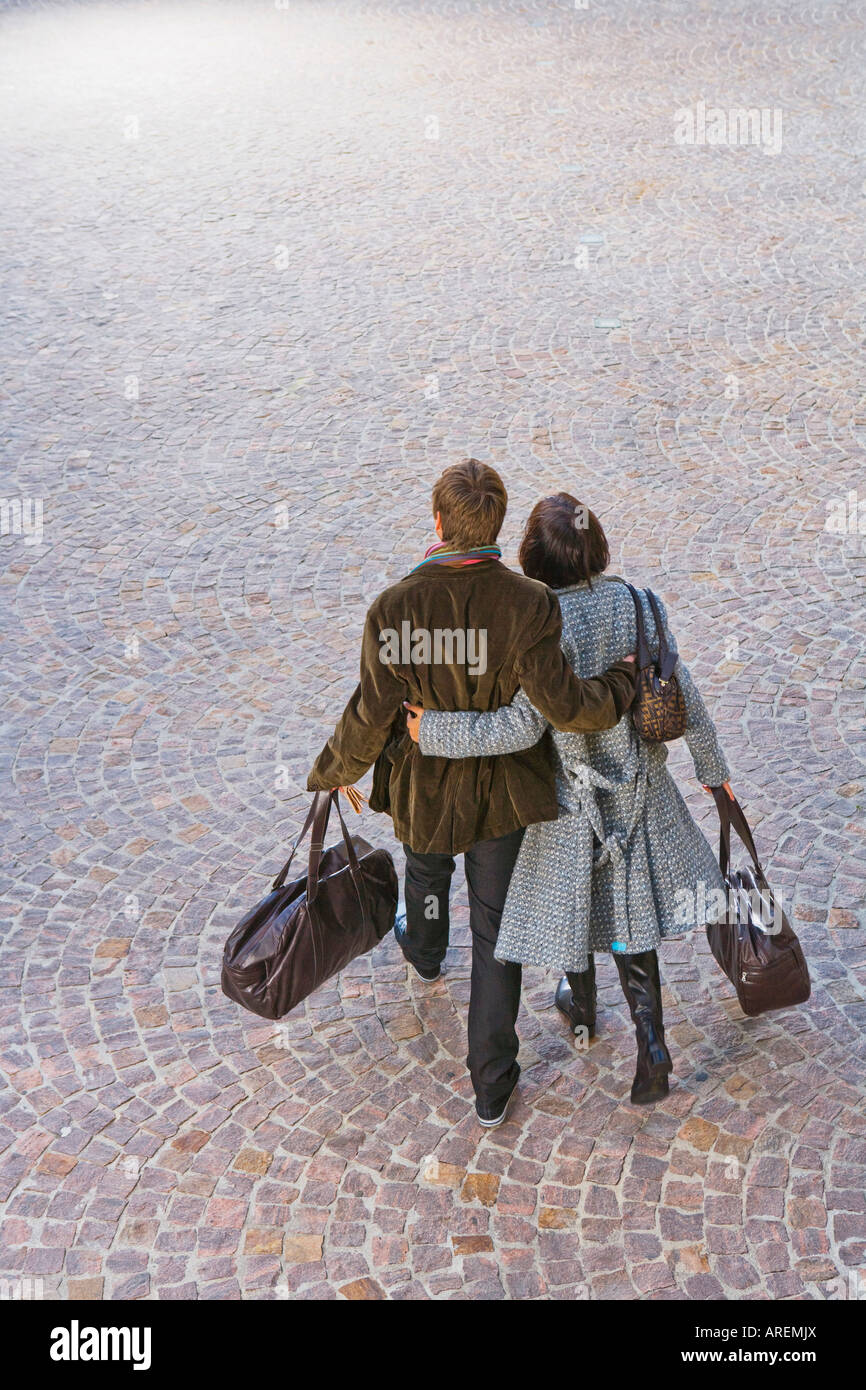 Man and woman arms around waists Stock Photo