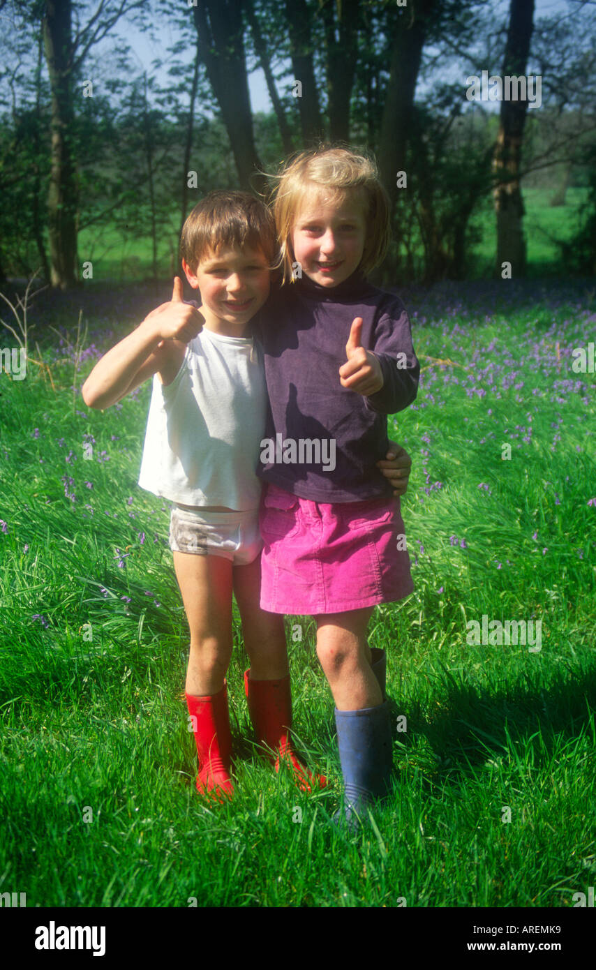 Non Identical Boy Girl Twins Playing In A Field Stock Photo Alamy
