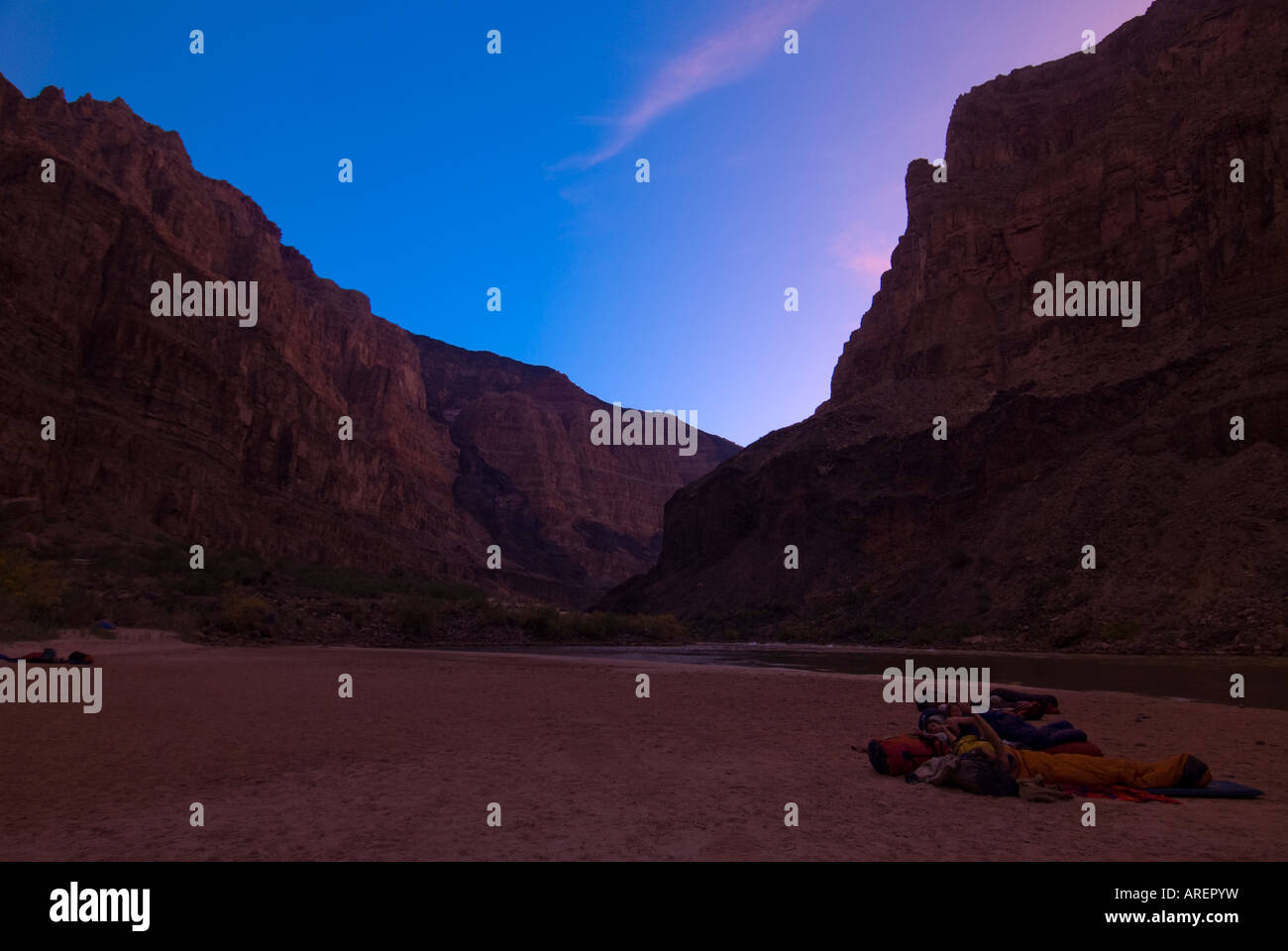 Campers sleeping on sandy beach in the desert of the Grand Canyon