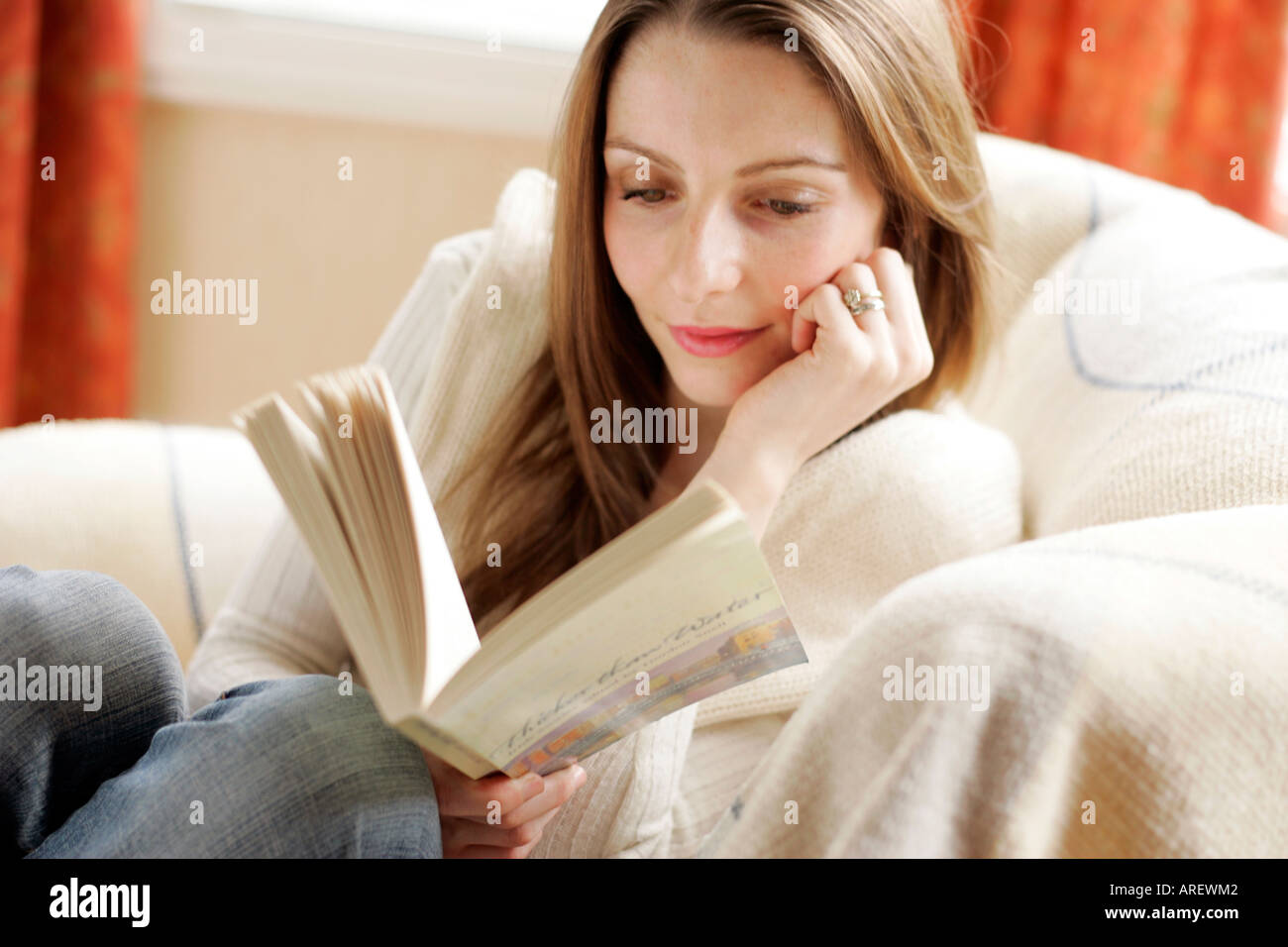 Woman reading a book Stock Photo