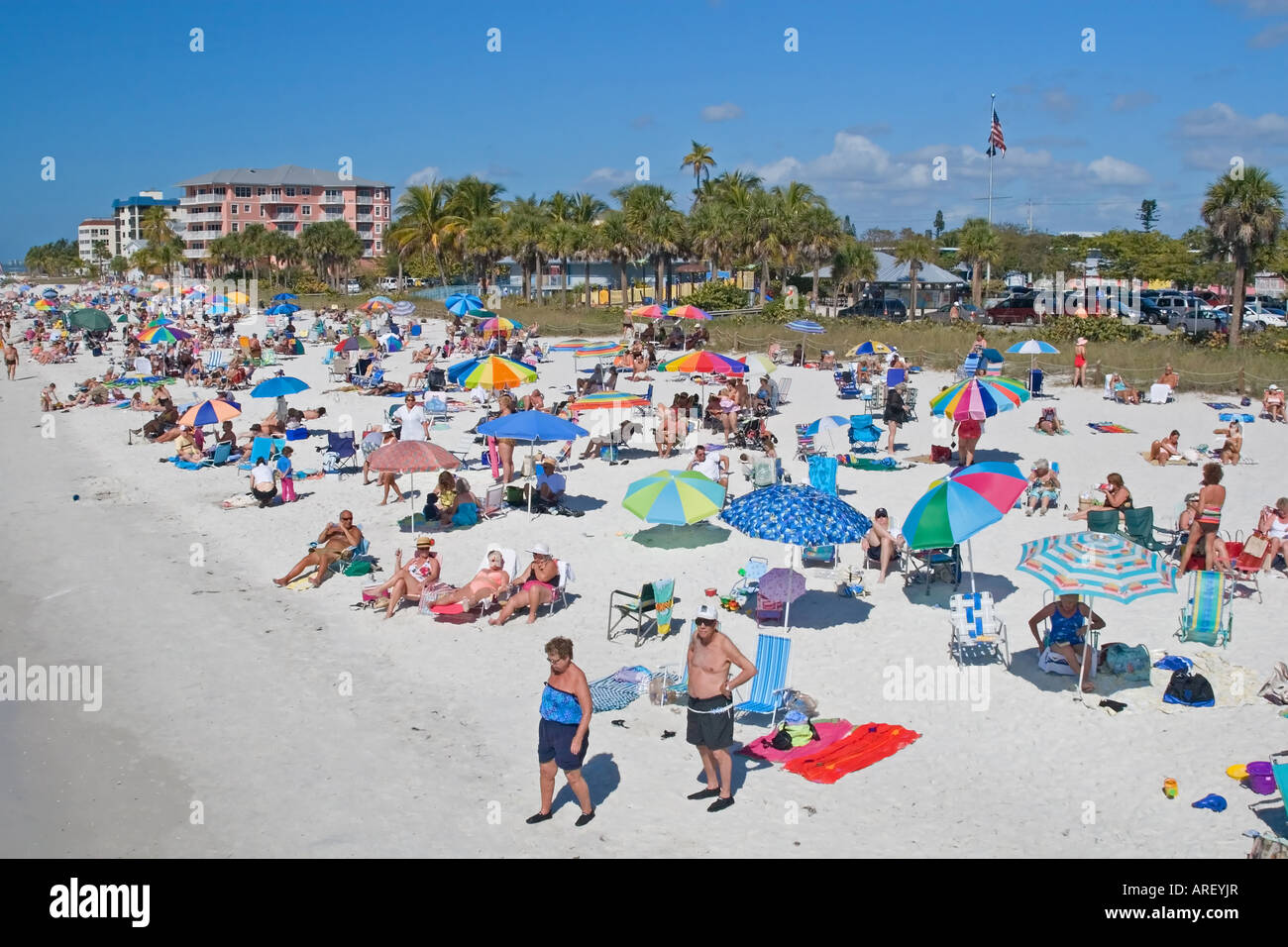 Tourists on the beach for summer vacation and in the water Stock Photo