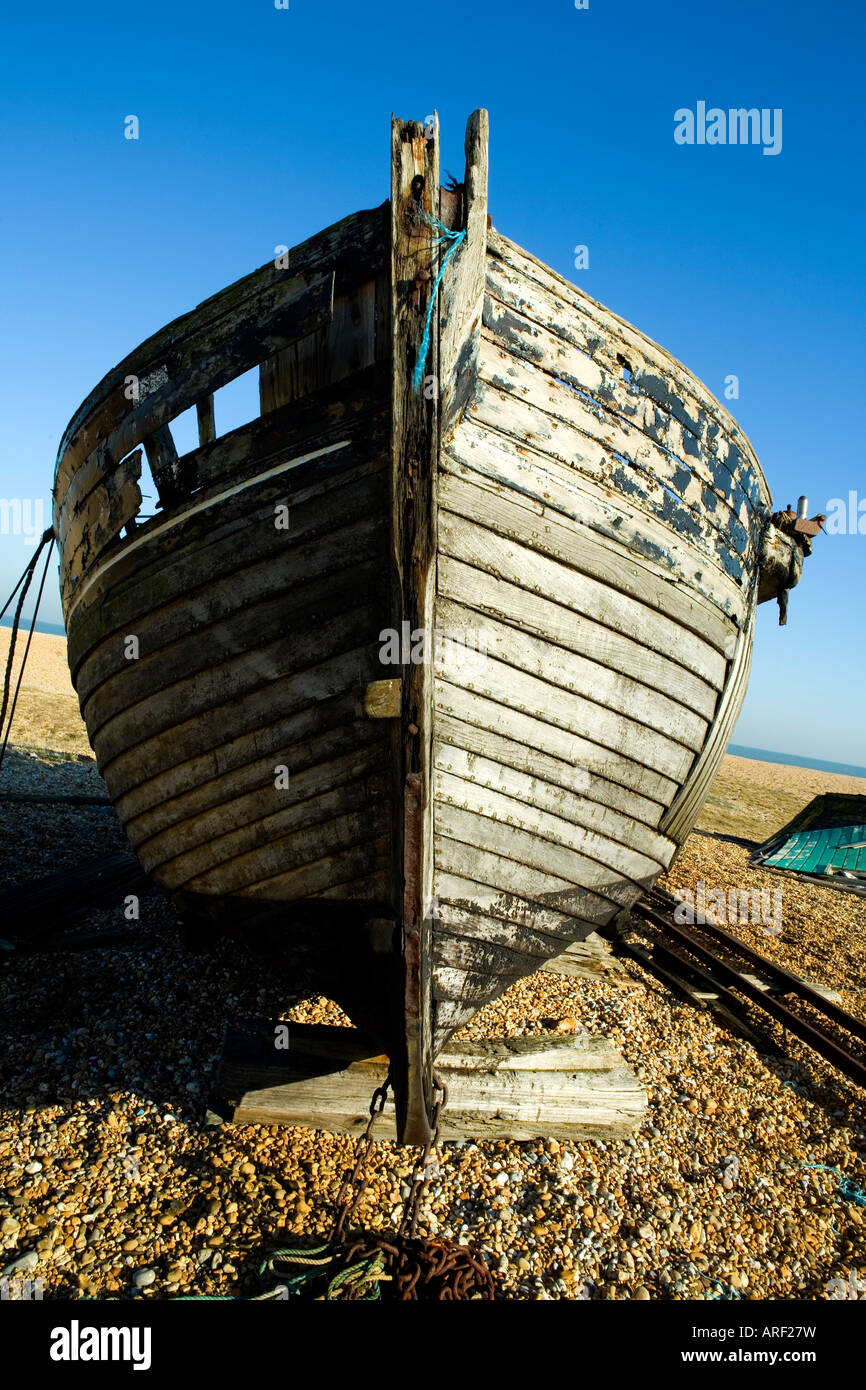 Old weathered fishing boat on a pebble beach in Dungeness, Kent on a ...