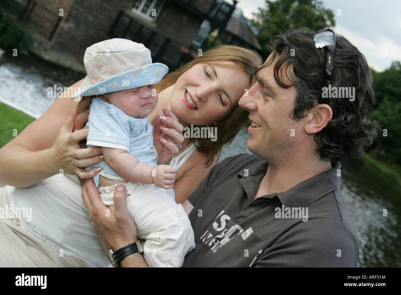 First Child, new family, baby, mum, dad Stock Photo - Alamy