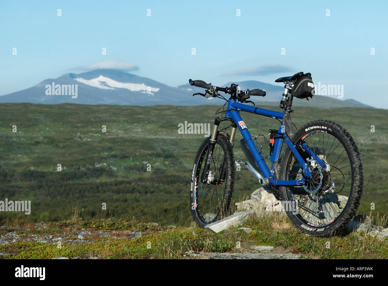 A mountainbike standing at a pile of stones in the background the Helags glacier Harjedalen Sweden August 2007 Stock Photo