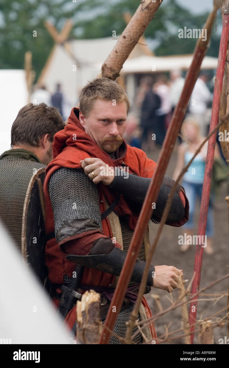 Viking warrior preparing for battle at a viking re-enactment festival Stock Photo