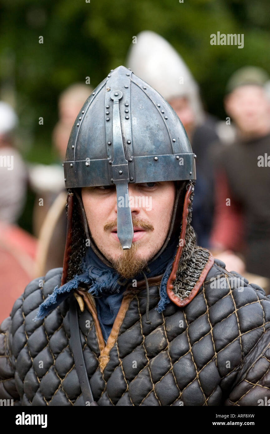 Close up of a viking warrior in helmet with nose guard at a battle re-enactment in Denmark Stock Photo