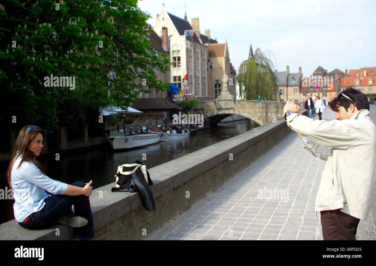 Couple enjoying the pleasures of Brugge riverways Stock Photo