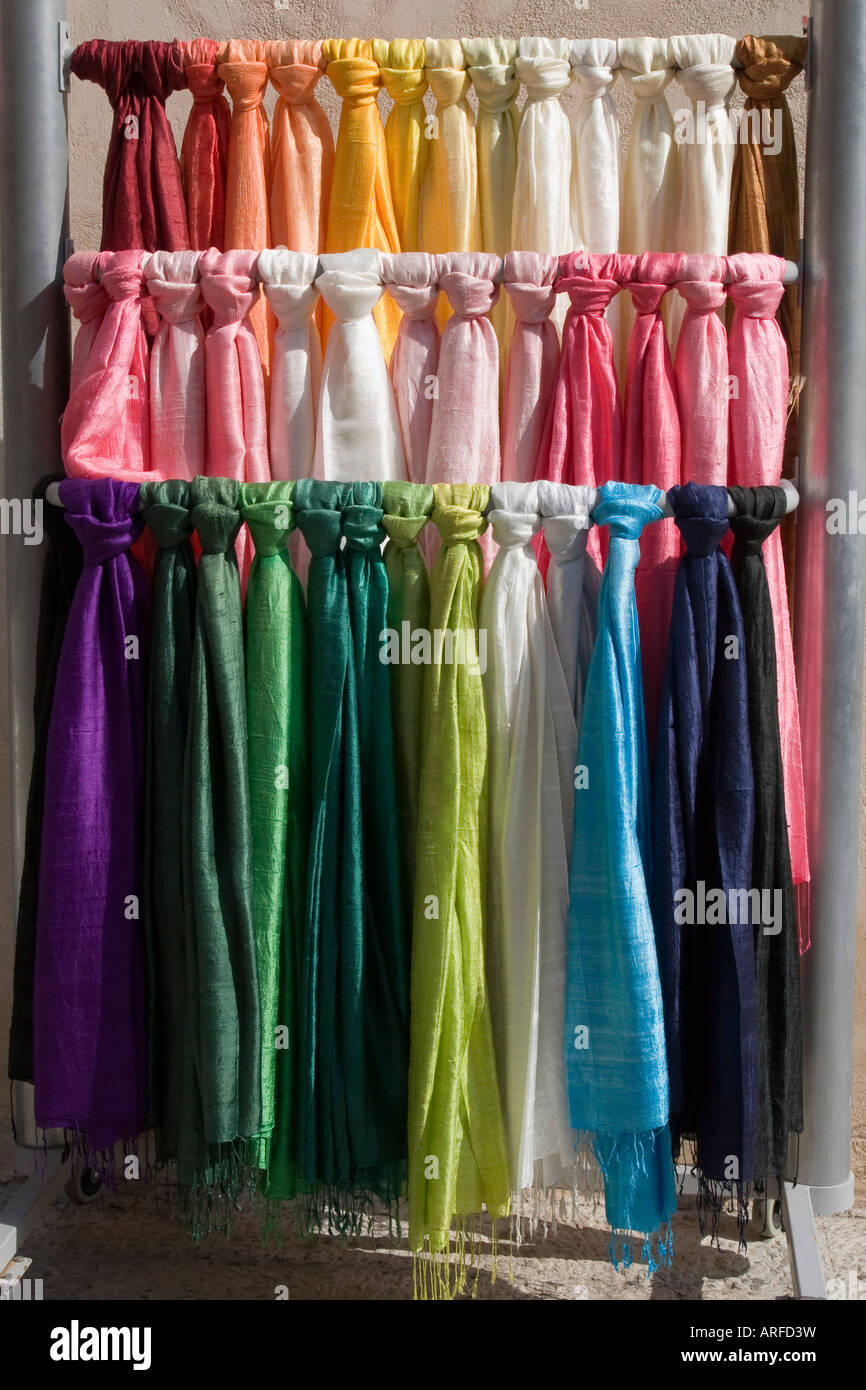 colorful silk scarves on 3 rails Stock Photo - Alamy