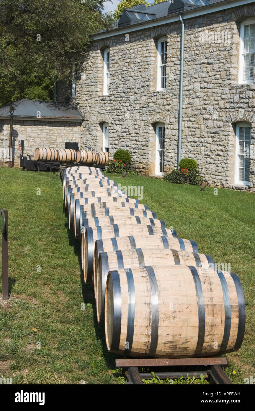 Whiskey or bourbon barrels at a distillery lined up and being moved after filling, Kentucky, KY, USA. Stock Photo