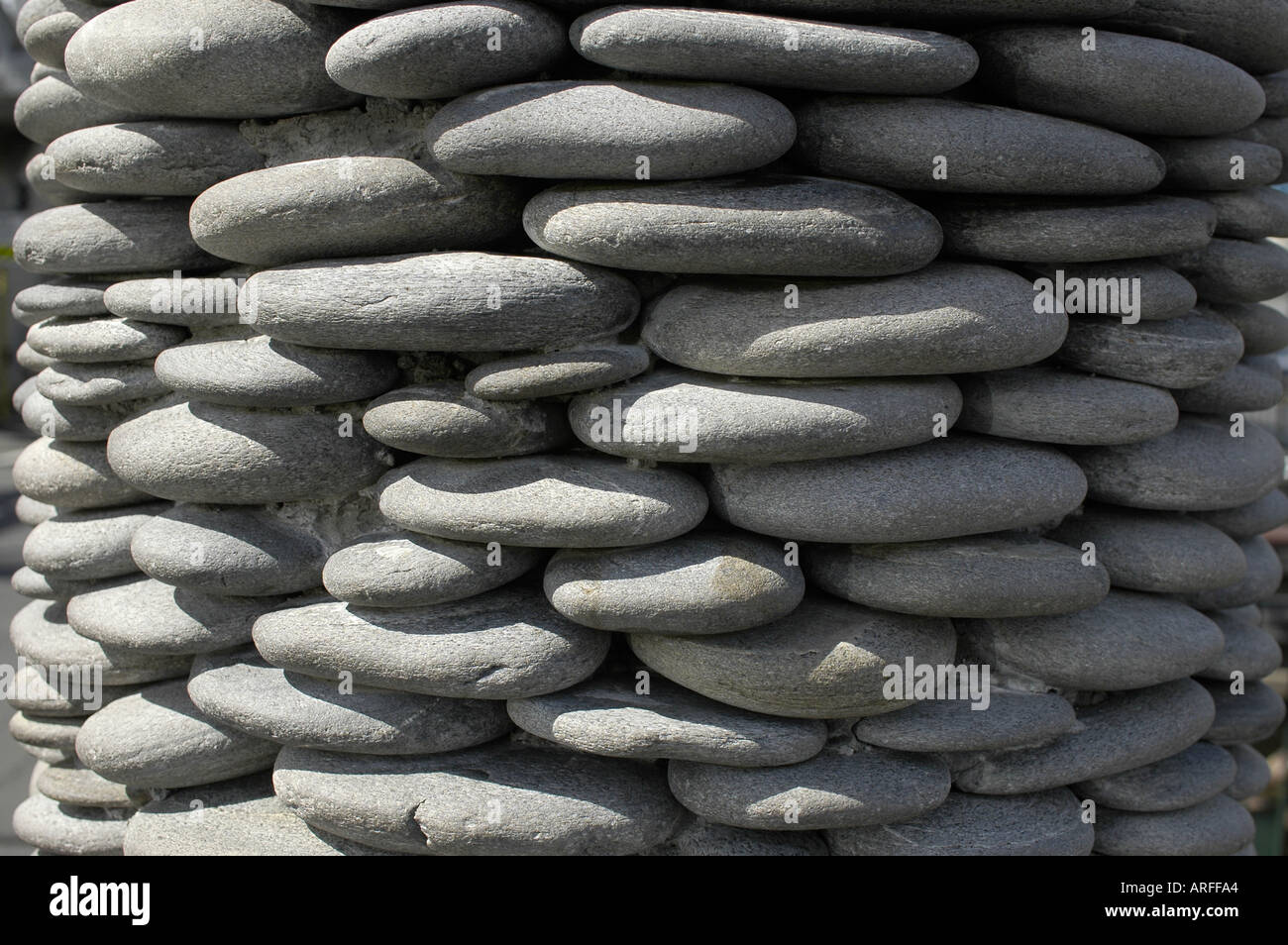 River stones stacked to make a pillar Close up 2004 Chris Cameron Stock Photo