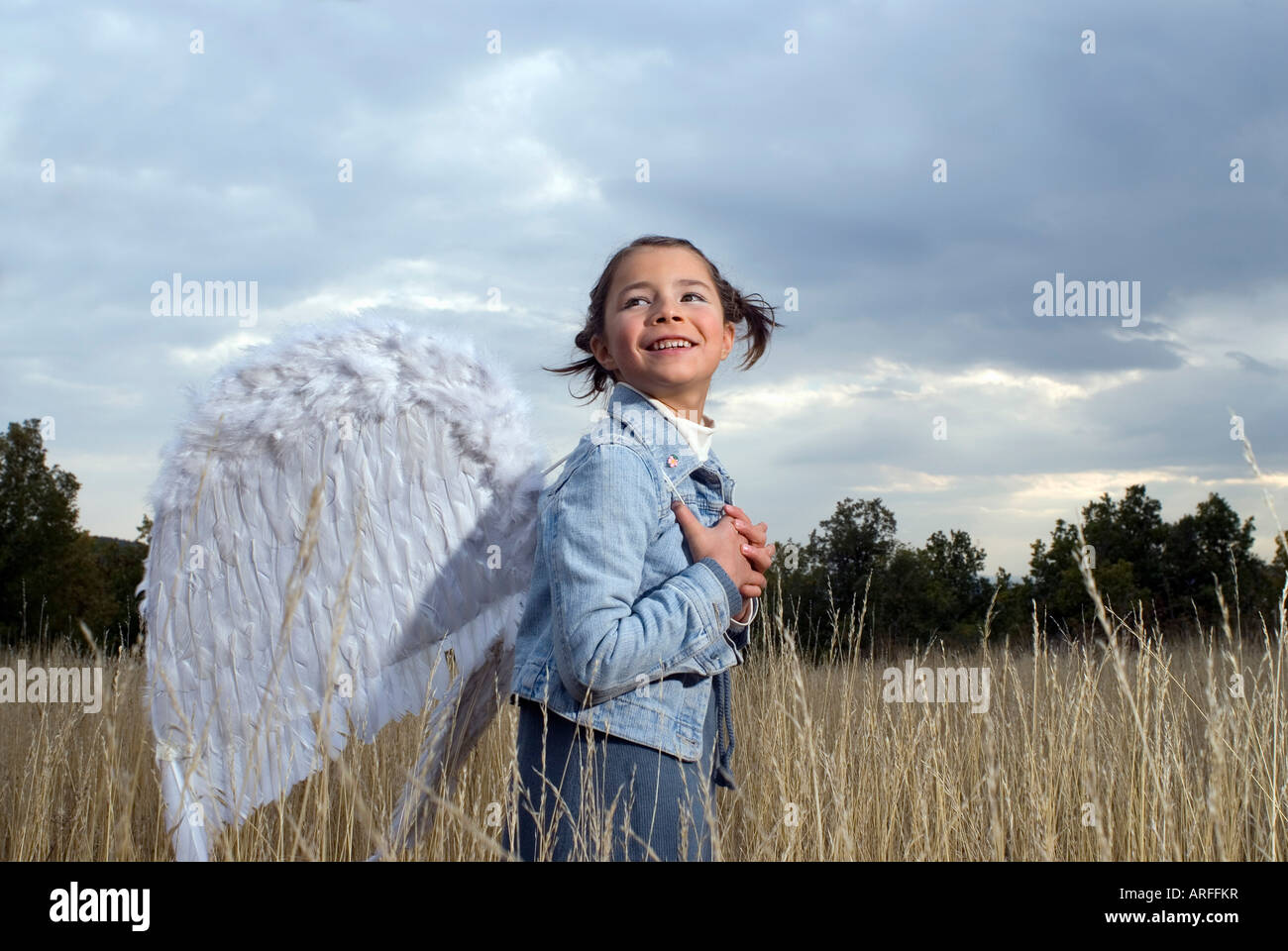 Girl wearing angel wings Stock Photo