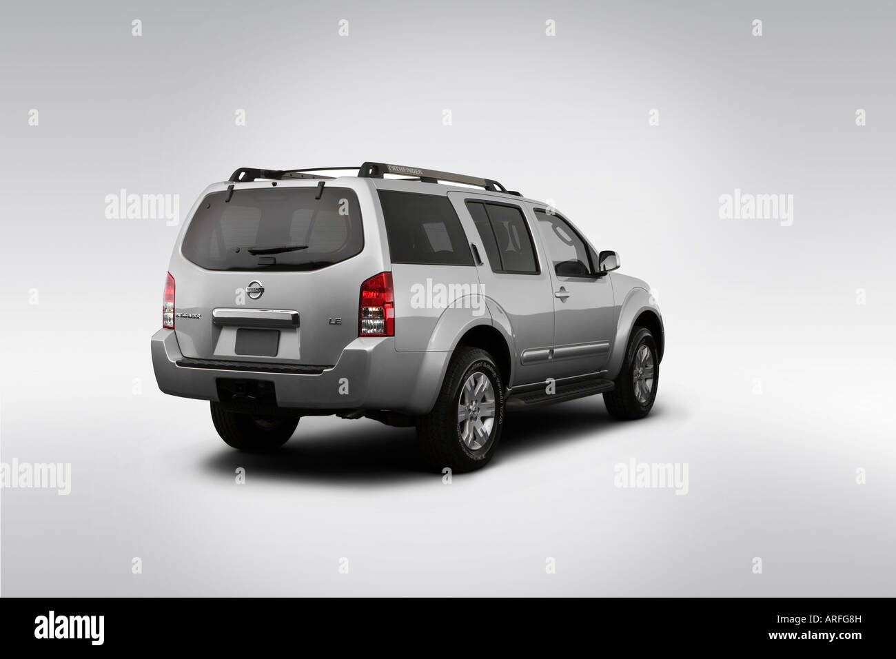 2007 Nissan Pathfinder LE in Silver - Rear angle view Stock Photo