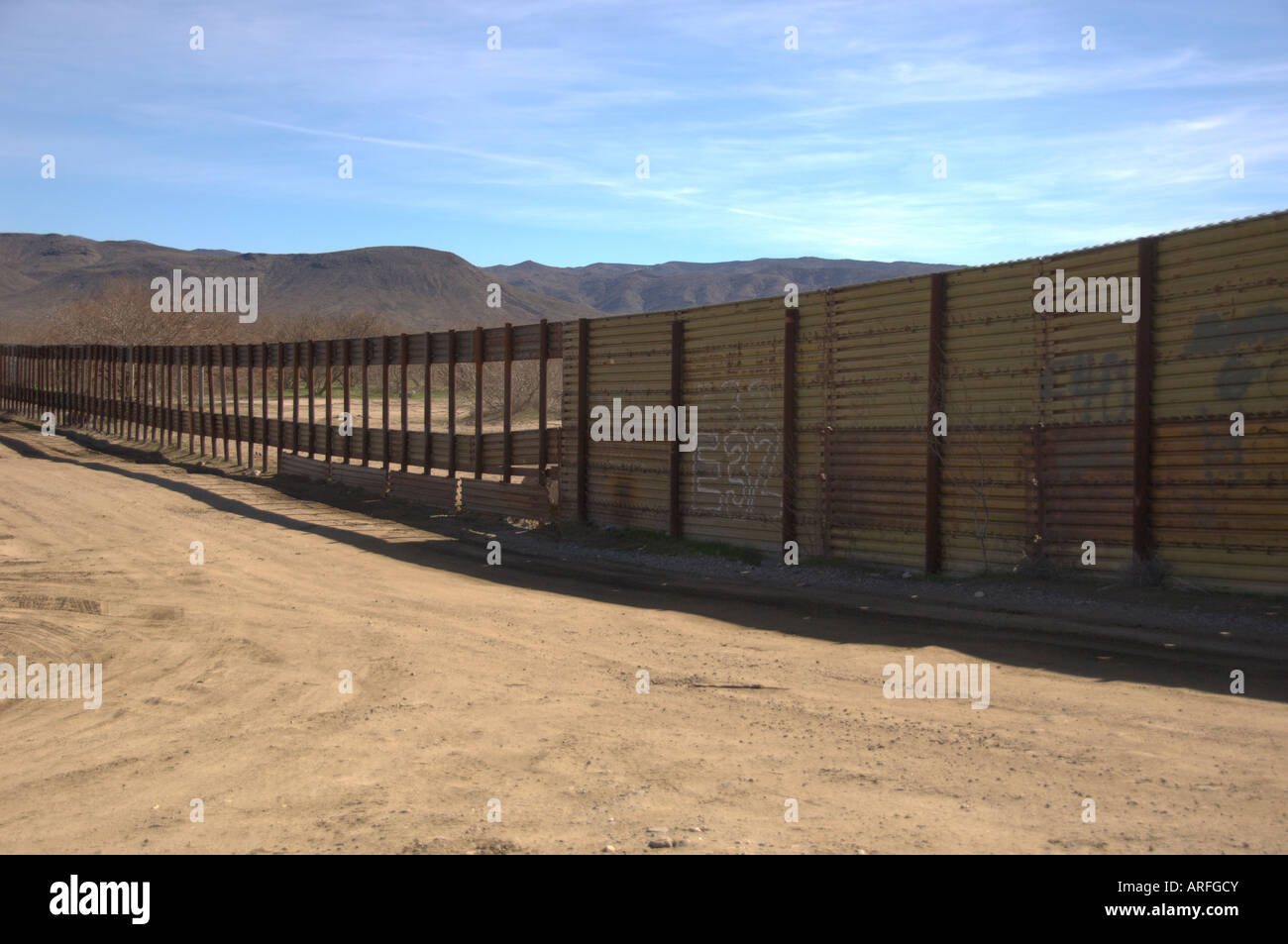 mexico-border-fence-with-holes-at-jacumba-california-ARFGCY.jpg