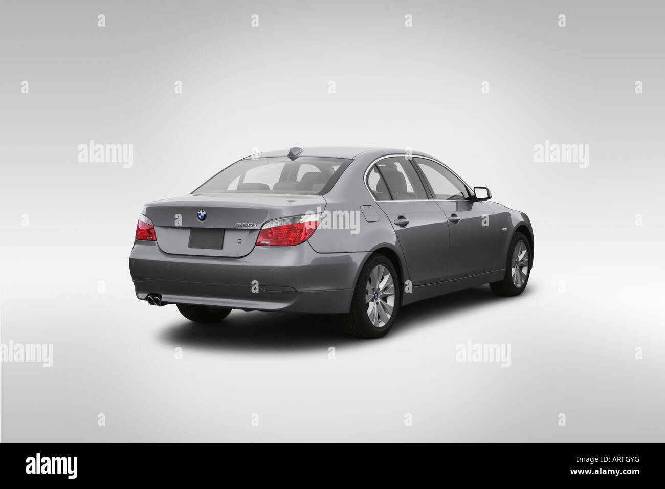 2007 BMW 5-series 550i in Silver - Rear angle view Stock Photo