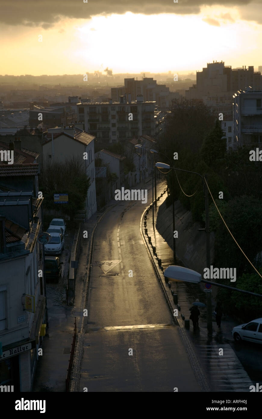 A shiny street leading into Paris after a storm Stock Photo