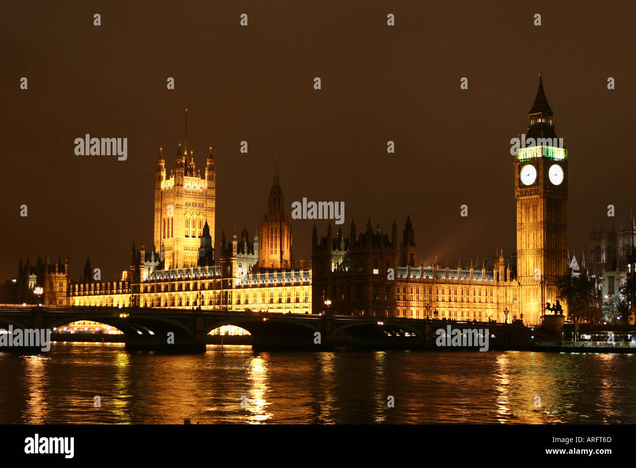 Houses of Parliament at night and Big Ben with relections in the River Thames Stock Photo