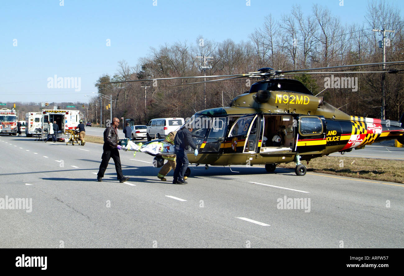 Firefighters rushed seriously injured person to Md State Police Medivac helicopter in Lahnam Md Stock Photo