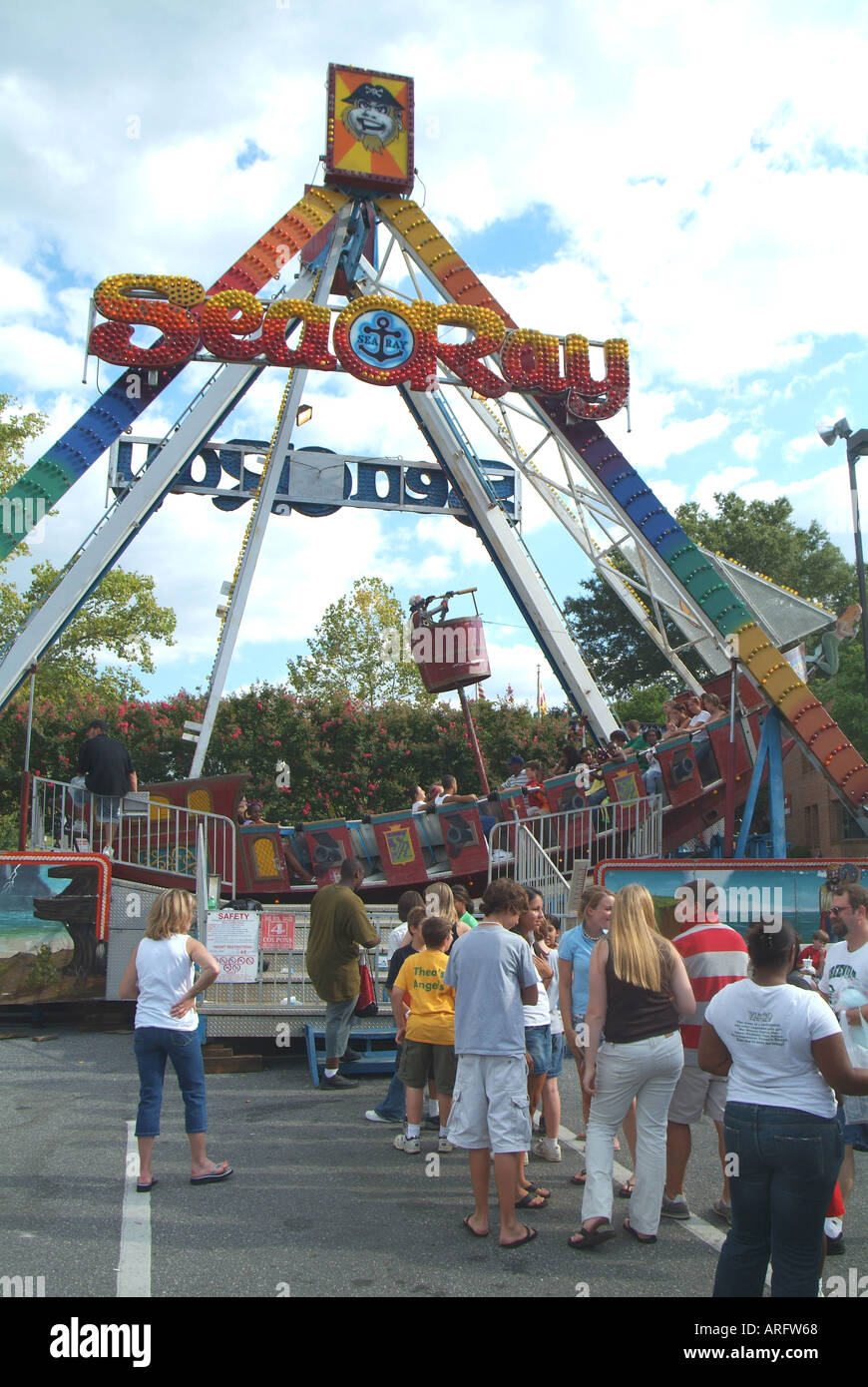 Festival activities including carnival rides at the labor day festival