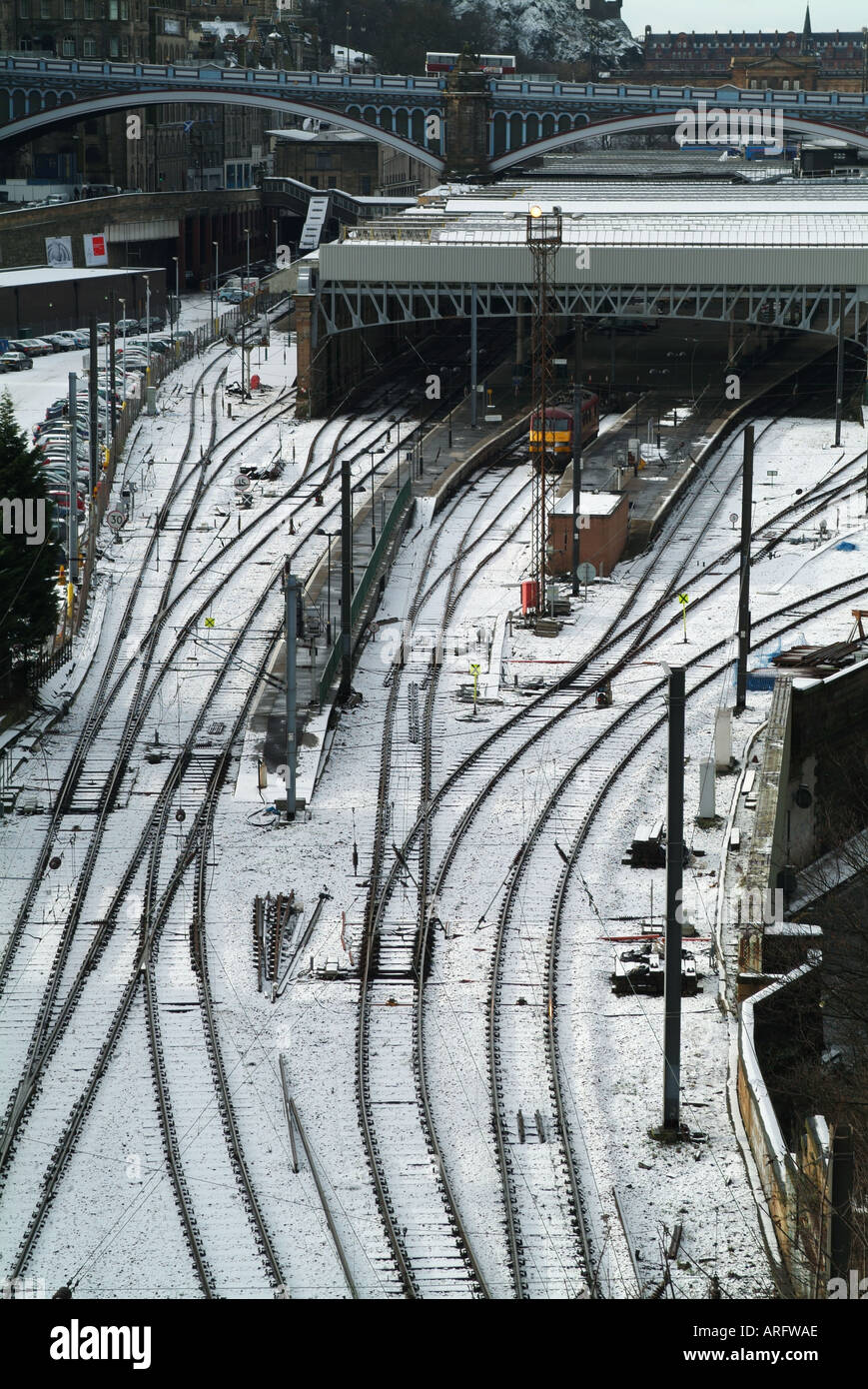 East side of Edinburgh Waverley railway station under snow station from Regent Road Stock Photo