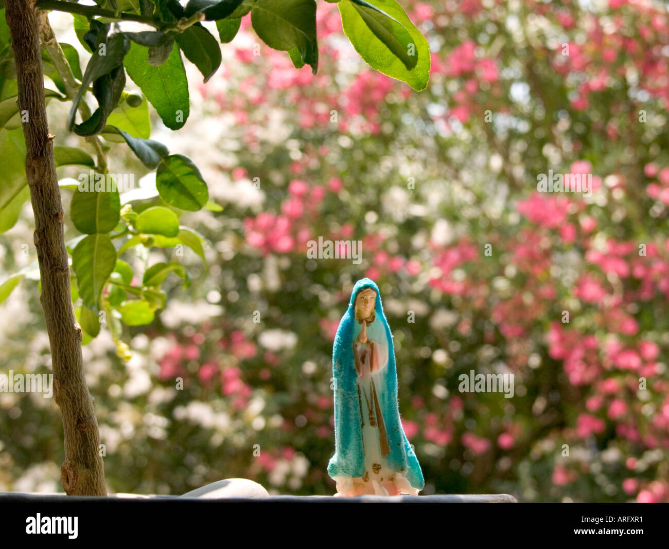 A close up of a small religious statue/souvenir called Fatima with