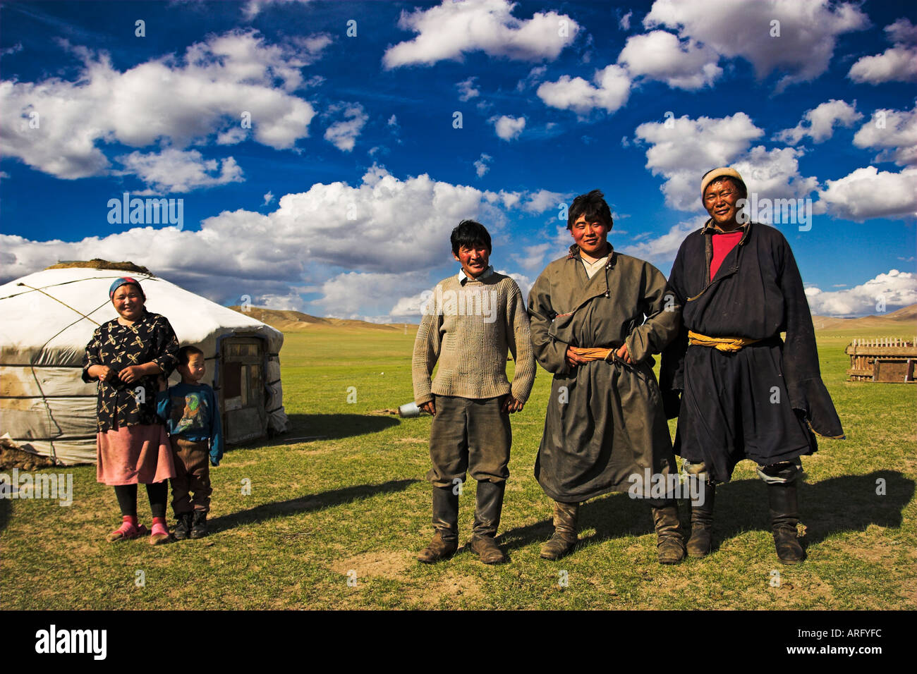 Mongolian family posing outside theyr gert camp Stock Photo - Alamy