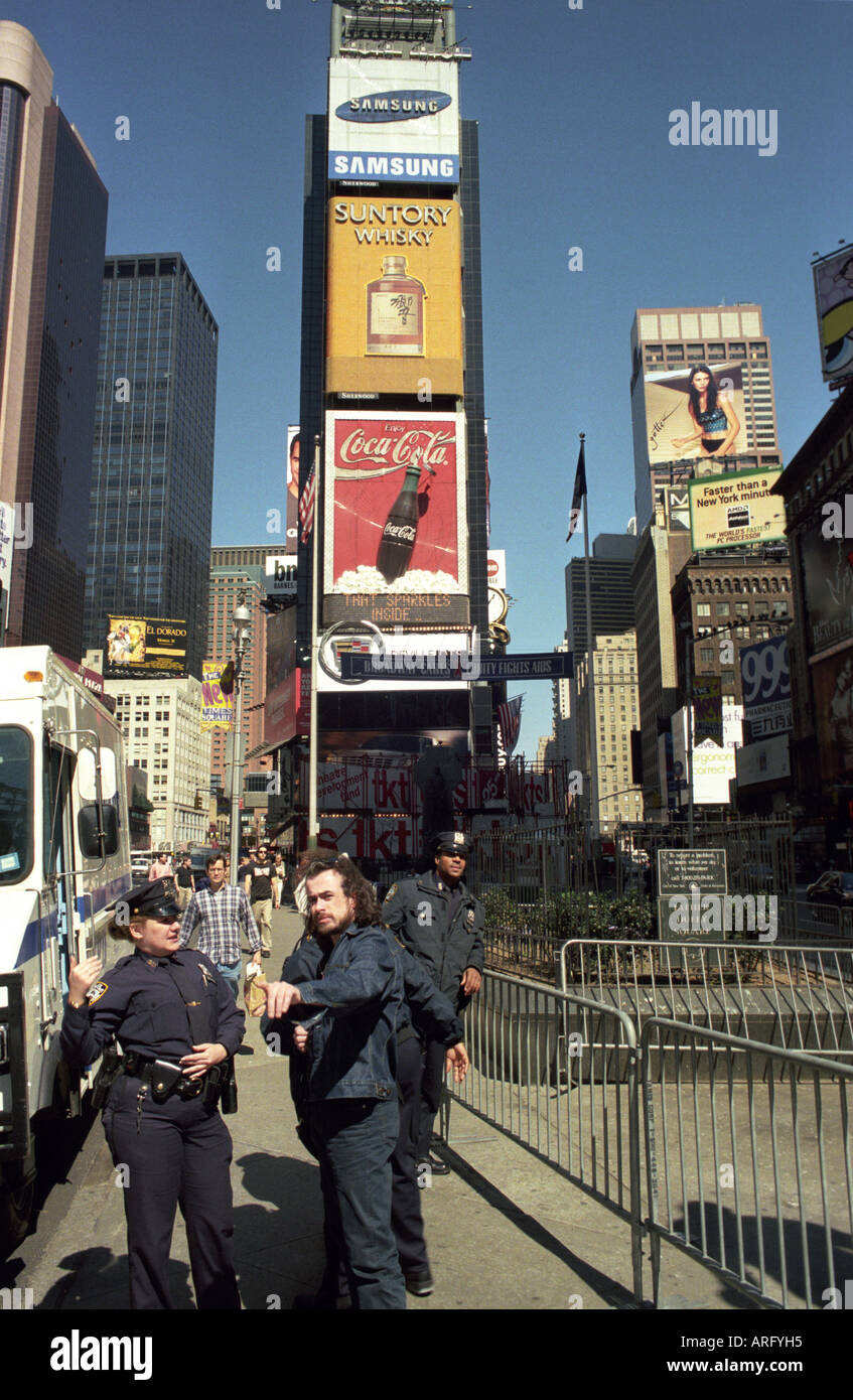 getting directions from a police officer in Times Square New York City ...