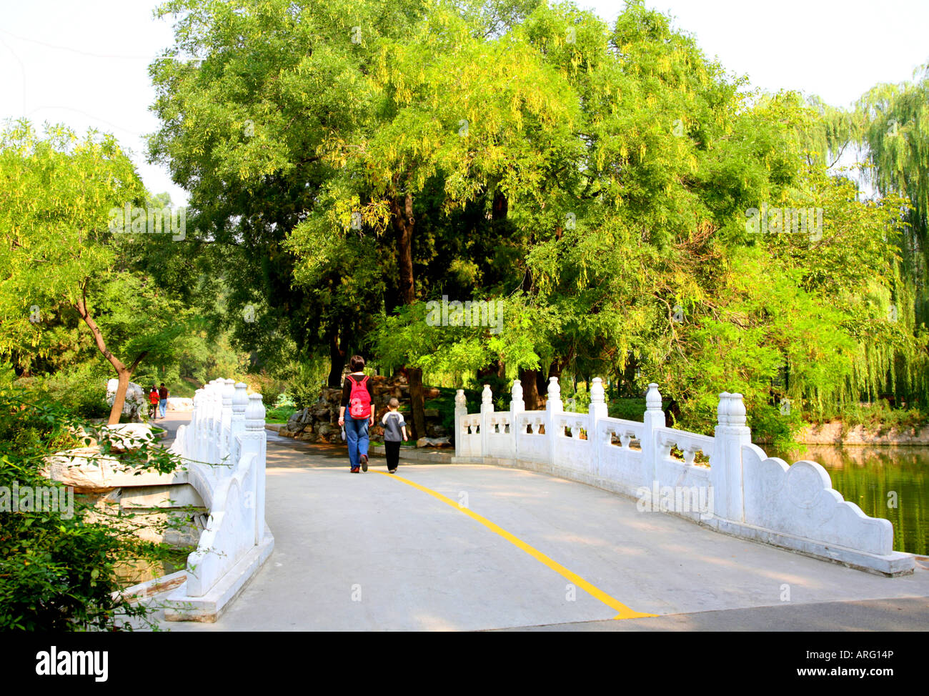 Mother and child on bridge in Beijing Zoological Park. Stock Photo