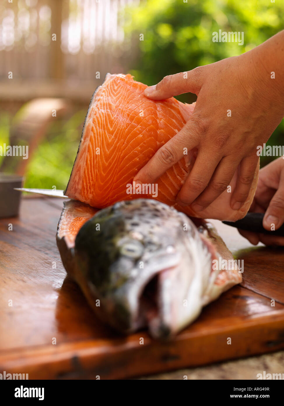 Person Filleting Fish Stock Photo