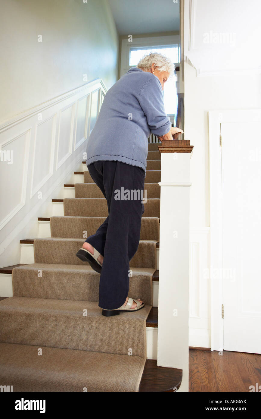 Senior woman stair rail hires stock photography and images Alamy