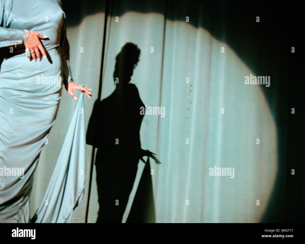 Drag Queen female impersonator show contest spotlight silhouette Stock Photo