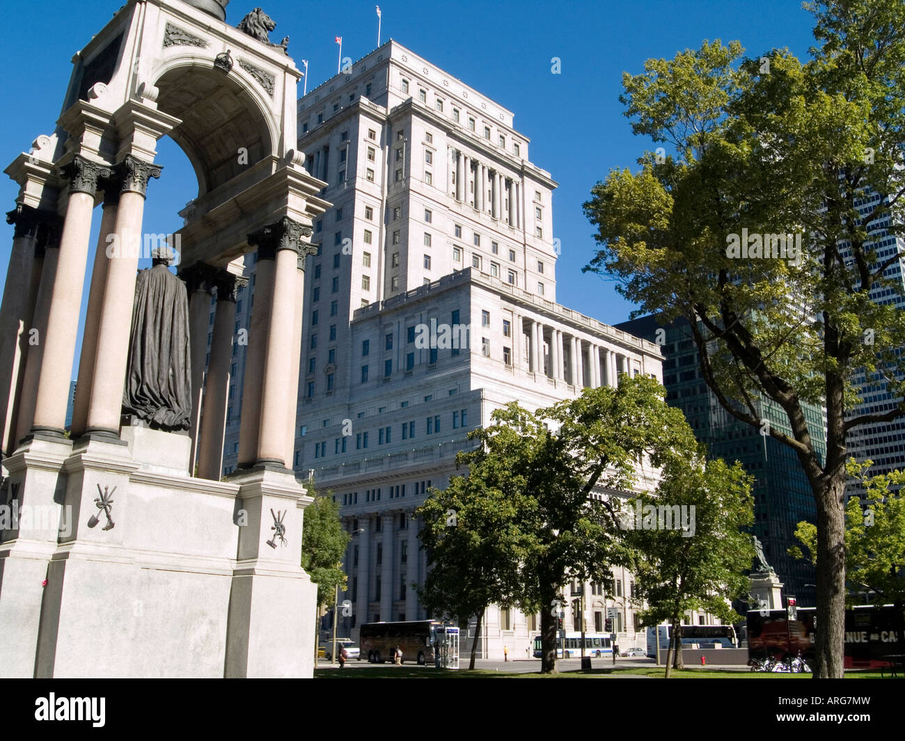 A statue of Sir John A MacDonald and the Sun Life Building at Place du Canada in Downtown Montreal, Quebec Canada Stock Photo