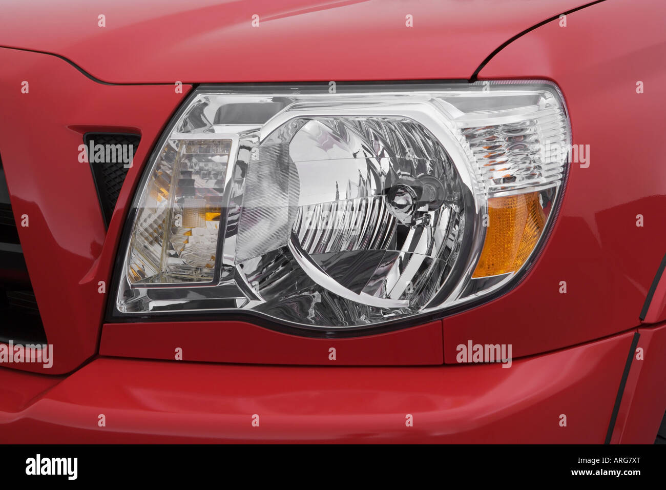 2007 Toyota Tacoma X Runner in Red - Headlight Stock Photo - Alamy