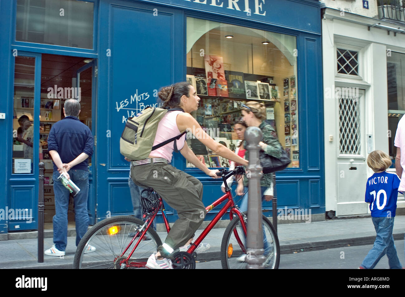 PARIS France, People, Street Scene  'Les Mots à la Bouche' 'Gay Bookstore' women biking outside Stock Photo