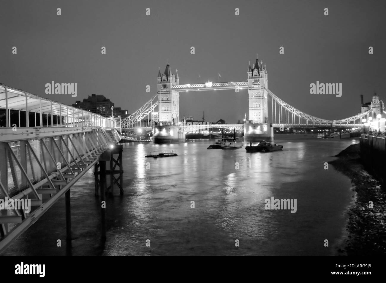 LONDON UK, England, Panoramic View of Tower Bridge from Gangway of Ship HMS Belfast Night 'Black and White' Thames River Scenic Stock Photo