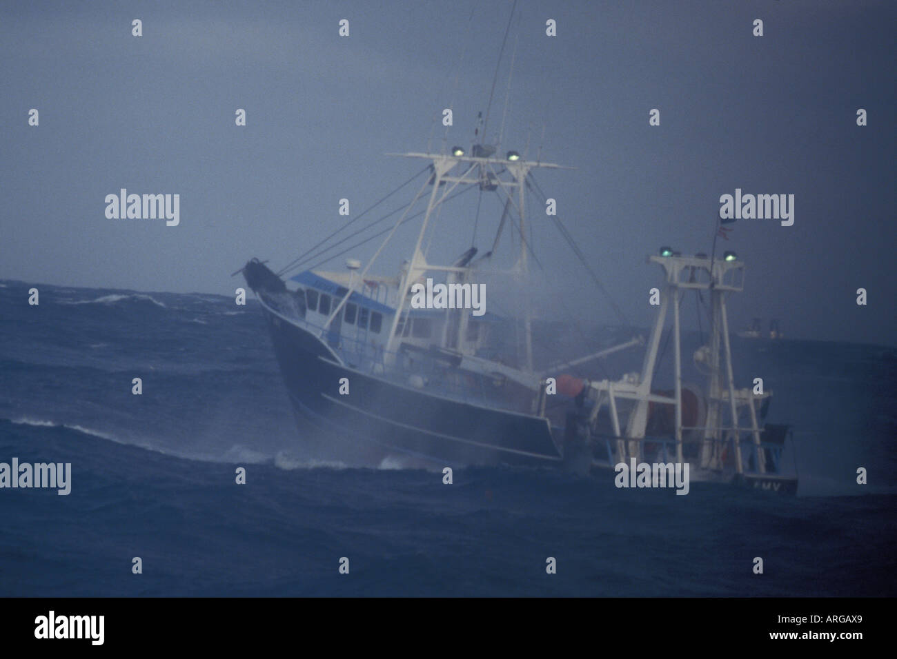 commercial dragger fishing vessel fishing for pollack in the Aleutian islands Alaska Bering Sea Stock Photo