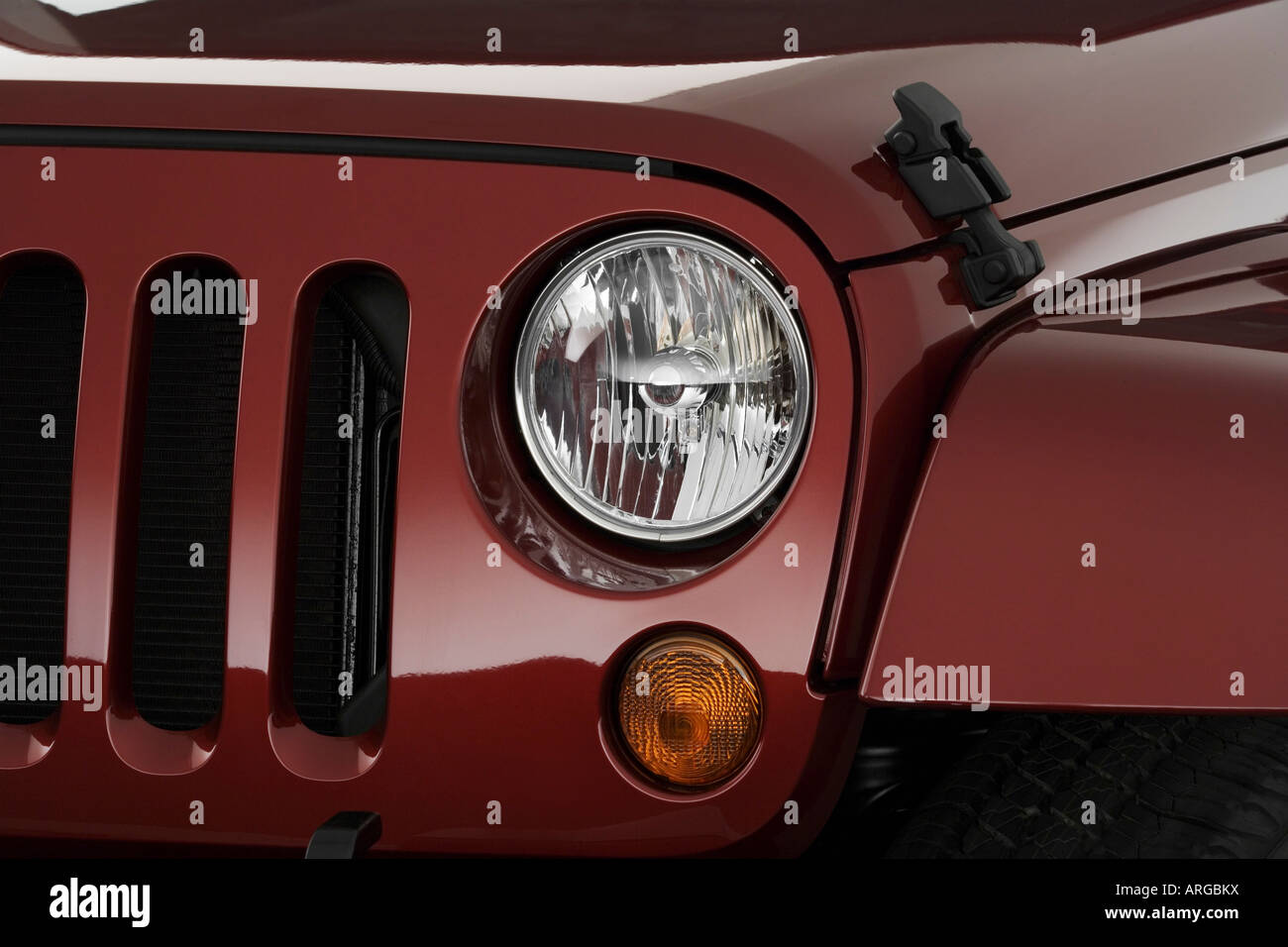 2007 Jeep Wrangler Sahara in Red - Headlight Stock Photo - Alamy