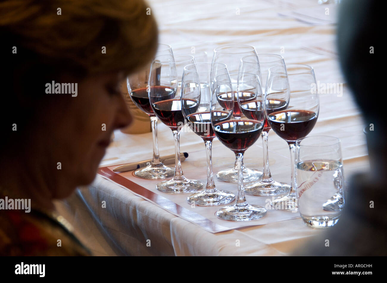 Group of people tasting red wine Stock Photo - Alamy