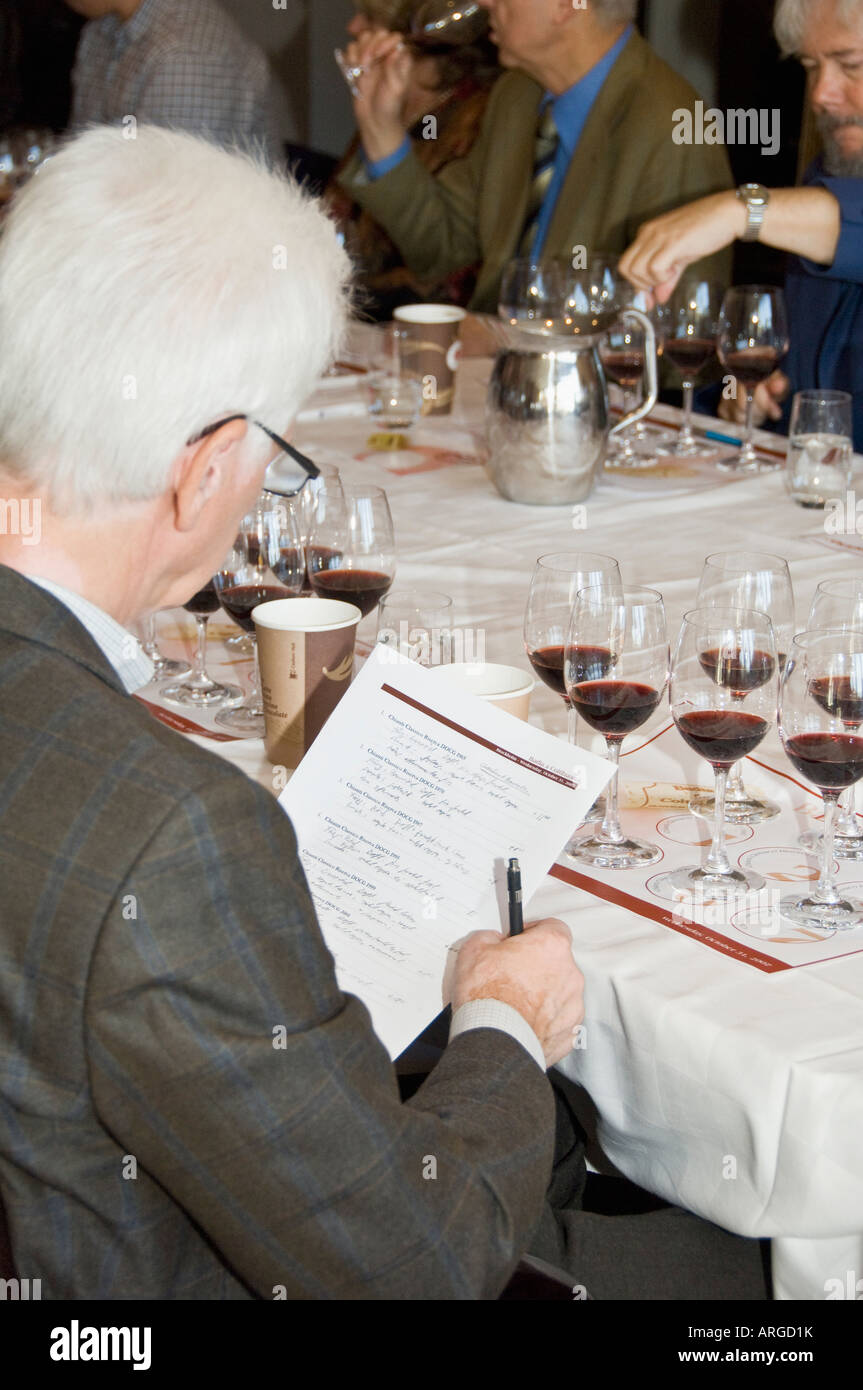 Group of people tasting red wine Stock Photo - Alamy