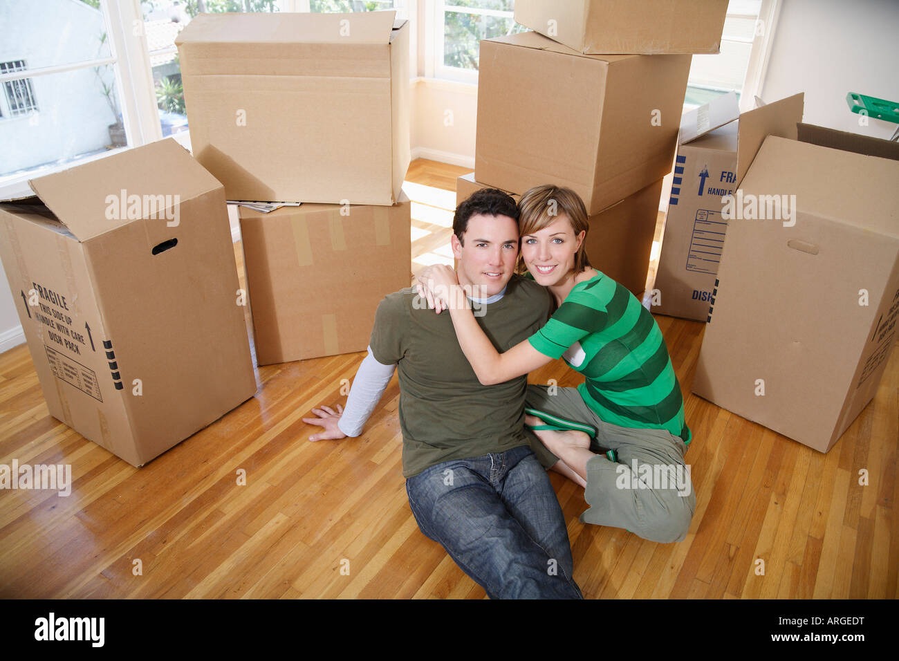 Couple Moving Into New Home Stock Photo - Alamy