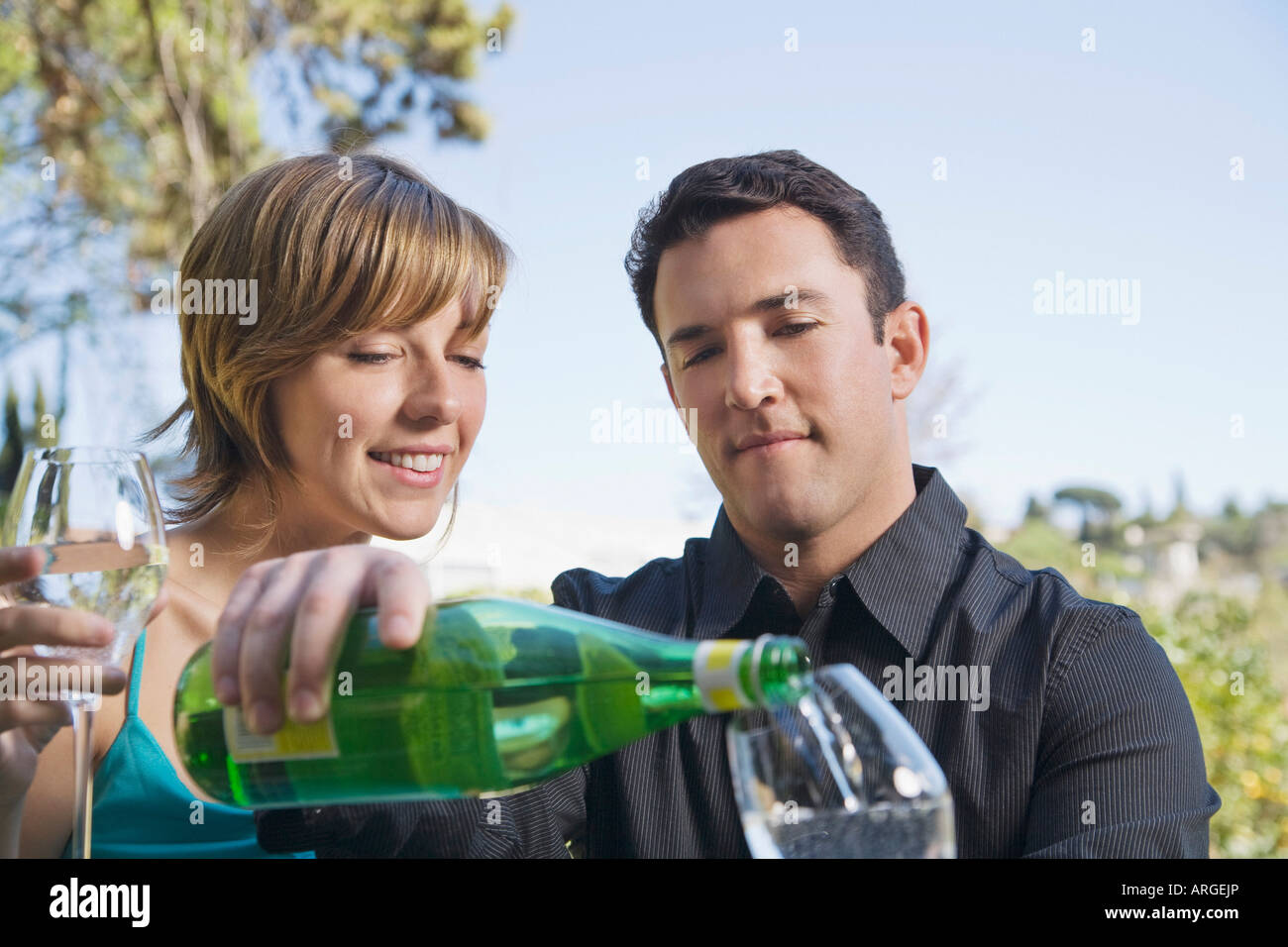 Couple Drinking Sparkling Water Stock Photo Alamy
