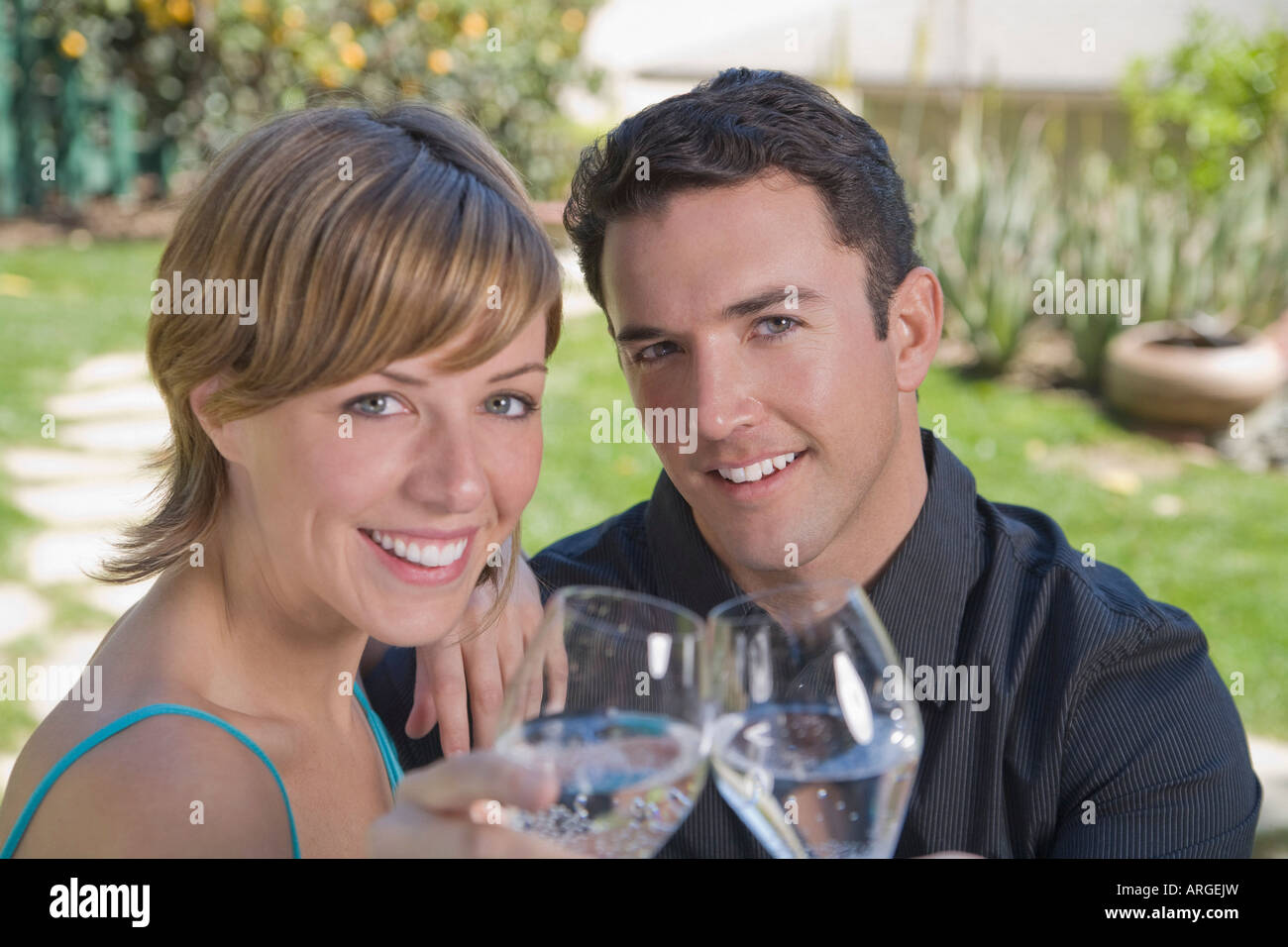 Portrait of Couple Drinking Sparkling Water Stock Photo Alamy